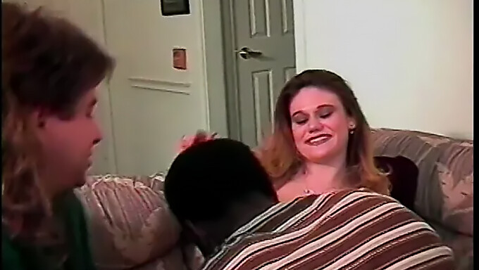 A Promiscuous Brunette Woman Performs Oral Sex On A Man'S Penis And Testicles While Being Aggressively Penetrated From Behind By A Black Man. This Encounter Includes The Act Of Doggystyle And Showcases The Man'S Inked Body.